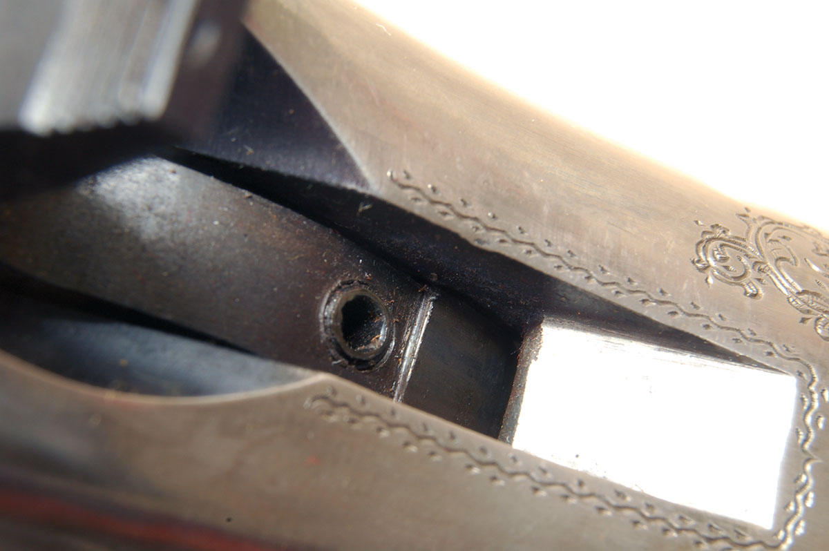 This is the sear adjustment screw on the back of the hammer of all FBW actions.